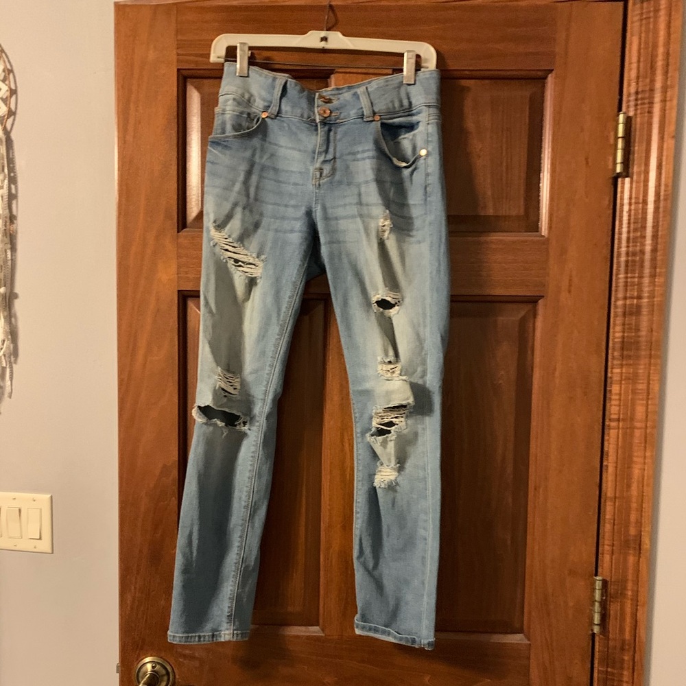 Distressed light washed blue jeans